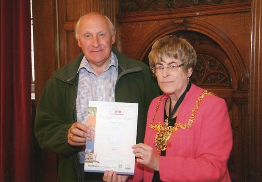 The silver prize is presented to Crosspool Forum chairman Ian Hague by Lord Mayor Sylvia Dunkley at the Town Hall